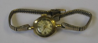 A lady's wristwatch contained in a 18ct gold case