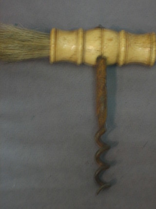 A 19th Century steel corkscrew with turned ivory handle and brush