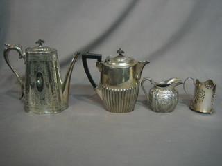 An oval Britannia metal hotwater jug with demi-reeded decoration, a Britannia metal coffee pot, do. cream jug and pierced silver plated glass holder