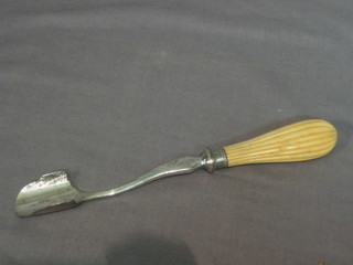 A silver plated marrow scoop with ivory handle