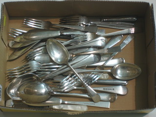 A collection of silver plated flatware