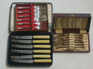 2 sets of 6 silver plated pastry forks and a set of 6 tea knives, all cased