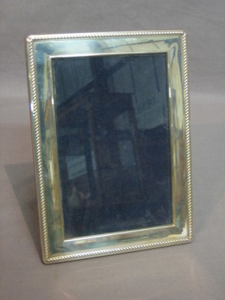 A modern silver easel photograph frame 7" x 5 1/2"