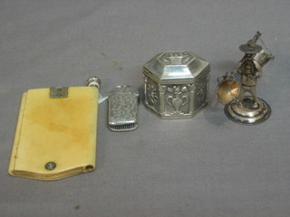 An ivory aide memoir, a small silver vesta case, an Eastern trinket box and cover 2" and a silver model of a figure with a yoke