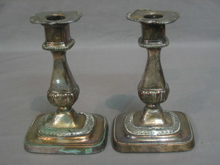 A pair of 19th Century silver plated candlesticks 7"