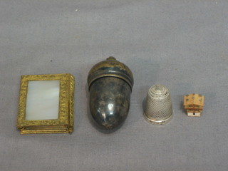 A silver thimble, a miniature book and 2 other items