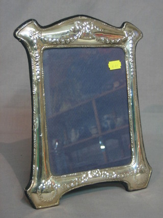 A modern silver easel photograph frame 11" x 9"