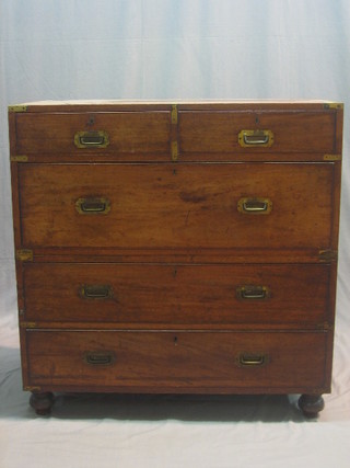 A 19th Century Camphor wood military chest with brass corners and brass counter sunk handles, in 2 sections, fitted 2 short and 3 long graduated drawers, raised on bun feet 38"