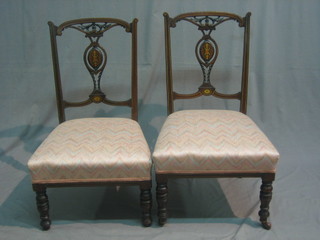 A pair of Victorian inlaid mahogany salon chairs