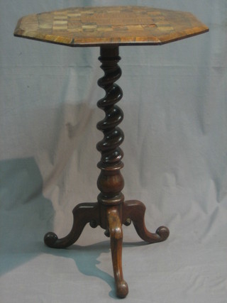 A Victorian octagonal rosewood wine table, the top inlaid a chessboard and raised on spiral turned and column supports 20"