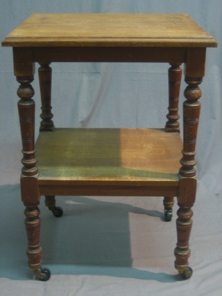 A 19th Century mahogany 2 tier what-not raised on turned supports 23"