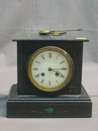 A Victorian striking mantel clock with enamelled dial and Roman numerals contained in a black marble case