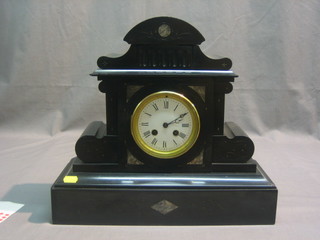 A Victorian striking mantel clock with enamelled dial and Roman numerals contained in a black marble architectural case