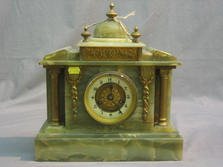A Victorian French 8 day striking mantel clock contained in an onyx architectural case