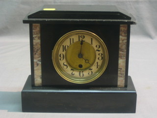 A French Art Deco mantel clock with Arabic numerals,  contained in a black marble architectural case
