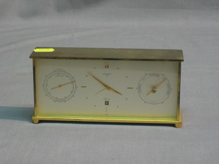 A 1950's 8 day travelling clock, barometer and thermometer with calendar aperture by Luxor and retailed by Aspreys