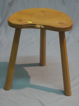 A carved honey oak 3 legged Mouseman stool 40"