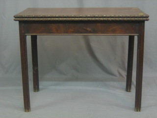 A 19th Century mahogany Chippendale style card table, raised on square supports 35"