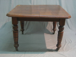 A Victorian mahogany extending dining table with 1 extra leaf, raised on turned supports 40"