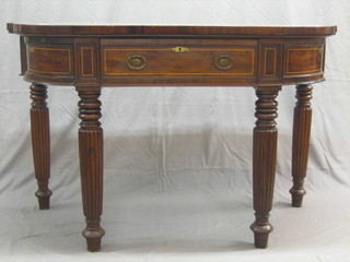 A Georgian mahogany bow front side table, inlaid satinwood stringing, fitted a drawer to the centre flanked by a pair of cupboards, raised on turned and reeded supports 55"