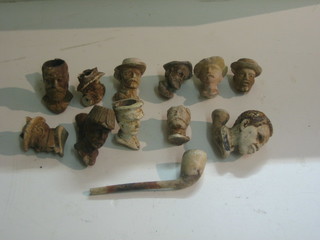 A clay pipe bowl in the form of Edward VII, do. George V (f) and 9 others together with a clay pipe