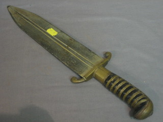 A double bladed dagger with brass hilt 11"