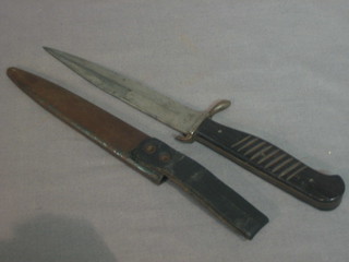 A WWI German dagger with 6" blade and metal scabbard