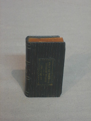 A wooden trinket box in the form of a book