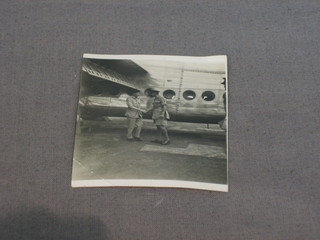 A black and white photograph of King George VI being greeted by Field Marshall Montgomery, standing by an aircraft 2" x 2"