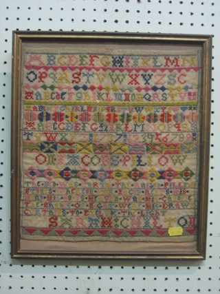 An 18th Century wool work sampler with alphabet and letters (some holes), the reverse labelled - This sampler an exercise in colour by Sarah Chilton 1737 bought for 7 and 6 in 1970 12" x 11"