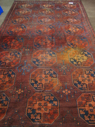 A 19th/20th Century Afghan rug with 24 octagons to the centre 123" x 71"