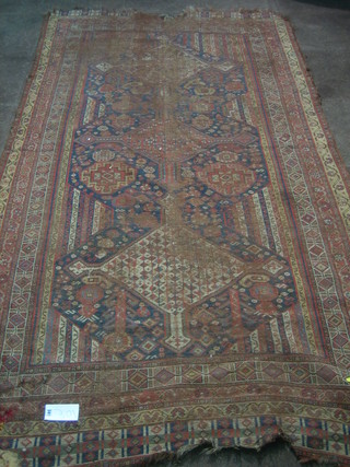 A Caucasian rug (heavily worn and some holes) 103" x 60"