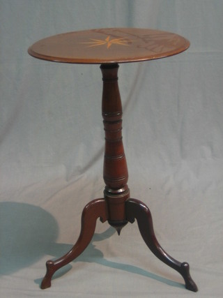 An Edwardian inlaid mahogany circular wine table raised on turned pillar and tripod supports
