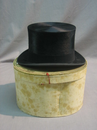 A gentleman's black silk top hat by Dunn & Co, complete with box