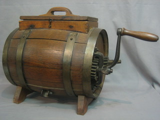 A table top butter churn in the form of a lidded barrel