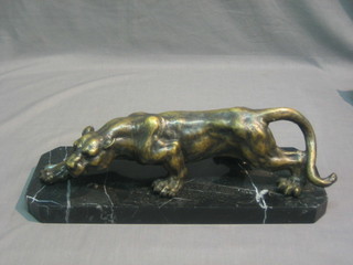 A modern bronze figure of a walking jaguar, raised on a lozenge shaped base 16 1/2"