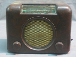 A Bush portable radio contained in a brown Bakelite case
