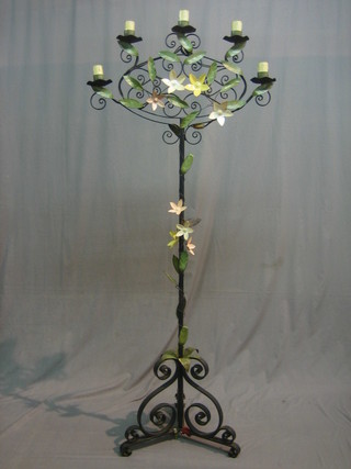 A large and impressive wrought iron 5 light standard lamp with floral decoration