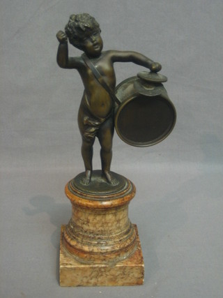 A 19th Century bronze figure of a standing cherub with drum and cymbal raised on a pink marble column 10" (drum stick missing)
