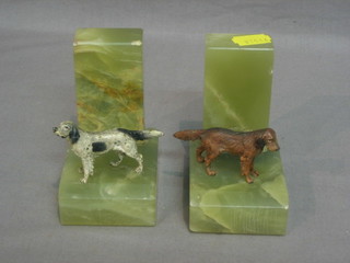 A pair of Art Deco onyx book ends decorated spelter figures of dogs