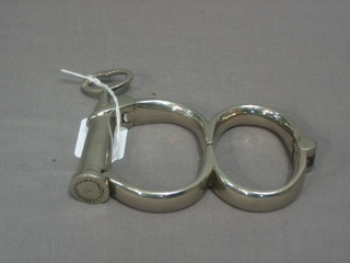 A pair of 19th Century chromium plated handcuffs