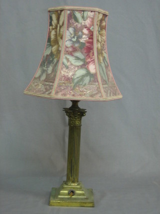 A reeded gilt metal table lamp in the form of a column with Corinthian capital 9 1/2"