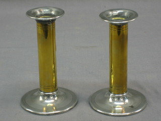 A pair of brass and silver plated stub shaped candlesticks 4" 