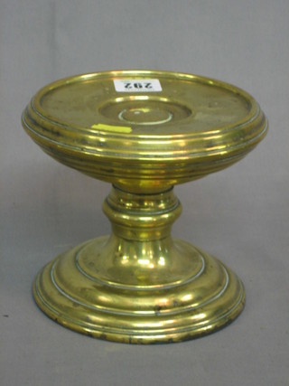 A circular brass lamp base 6"