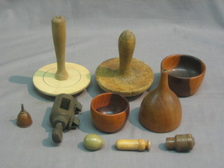 A good collection of various wooden spoons, rolling pins, mallets and other items of treen