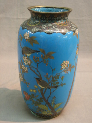 An Oriental blue ground cloisonne vase decorated a bird amidst branches 11"