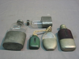 A collection of 7 19th Century hip flasks