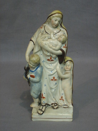 An 18th/19th Century Staffordshire figure of standing mother with children 7" (r)