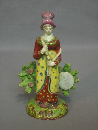 An 18th Century Staffordshire arbour group in the form of a standing lady archer 7"