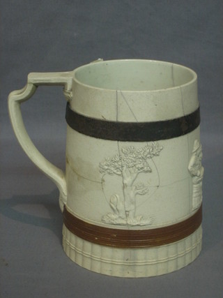 An 18th/19th Century Turonda salt glazed mug decorated seated figures, having an old blacksmith's repair 6"
